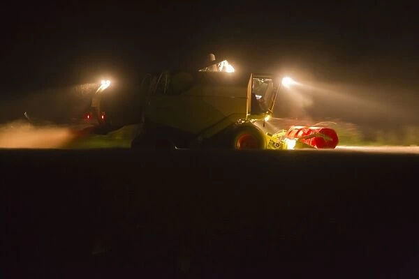 Combine Harvester - reaping corn at night - Lower Saxony - Germany