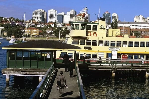 Commuters boarding ferry at Kurraba Point wharf to go to work in the city - Sydney, New South Wales, Australia JPF50631