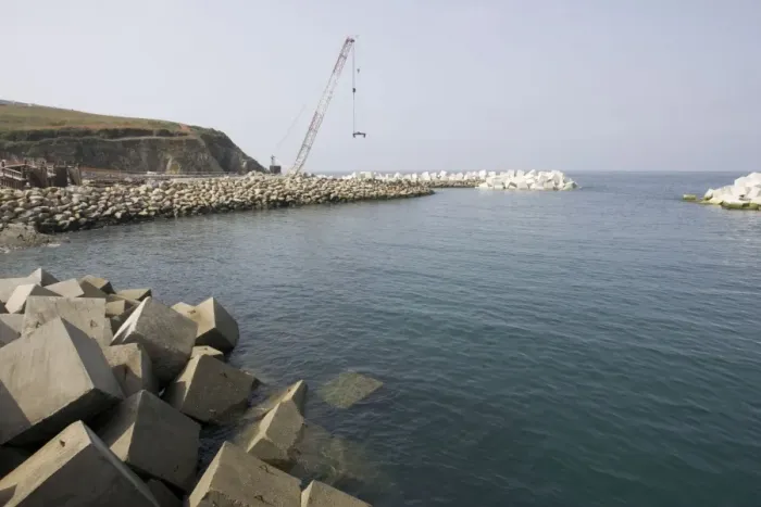 Framed Print : Constructing new breakwater outside harbour Puerto de Vega Costa Verde Northern Spain Framed Print : Constructing new breakwater outside harbour Puerto de Vega Costa Verde Northern Spain