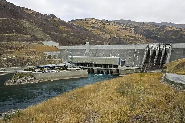 Dam - view of Clyde Dam and Lake Dunstan opened in 1994 New Zealand's third largest hydroelectric dam and the largest concrete gravity dam with a generation capacity of 400 MW providing 5% of the country's electricity