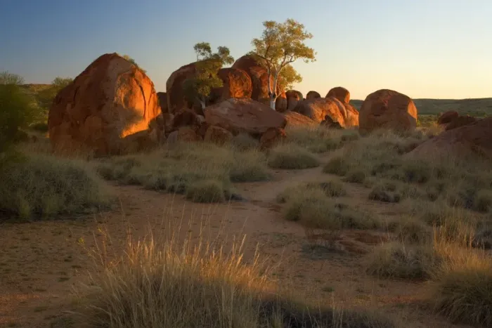 Framed Print : Devils Marbles - several circular shaped marbles of red granite situated amidst grassy bushland in last evening light - Devils Marbles Conservation Area, Northern Territory, Australia Framed Print : Devils Marbles - several circular shaped marbles of red granite situated amidst grassy bushland in last evening light - Devils Marbles Conservation Area, Northern Territory, Australia