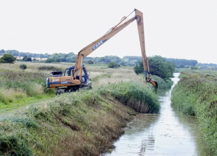 Framed Print : Digging out a ditch on one side only to avoid breaking insect life cycles and to preserve nesting habitat along one bank. Minsmere, Suffolk