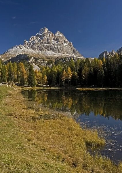 Dolomites: The Tre Cime (= Drei Zinnen) across Lago Antorno, in autumn Italy