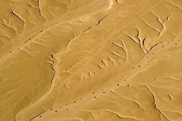 Drainage Patterns on the ancient Namib Plains - aerial view of the desert near Swakopmund - Vehicle tracks clearly scar the fragile plains below - Namib Desert - Namibia - Africa