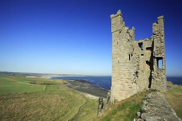 Dunstanburgh Castle - Lilburn Tower and North Sea coastline, Northumberland National Park, England