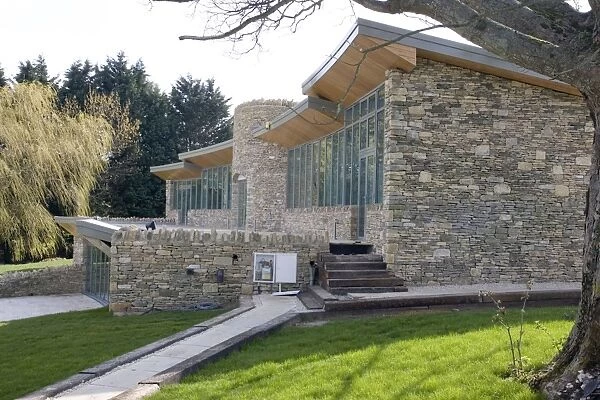 Eco-friendly Home - new expensive upmarket innovative Cotswold stone house with large expanse of glass windows and turf roof in AONB conservation area - Cotswolds - UK