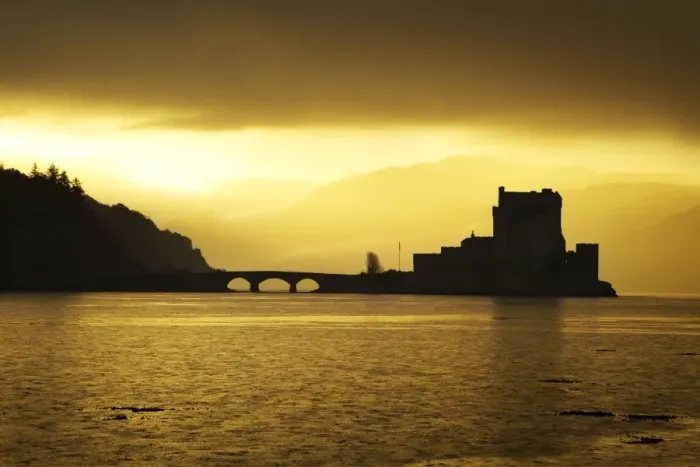 Framed Print : Eilean Donan Castle - being silhouetted in atmospheric conditions - November - Scotland Framed Print : Eilean Donan Castle - being silhouetted in atmospheric conditions - November - Scotland
