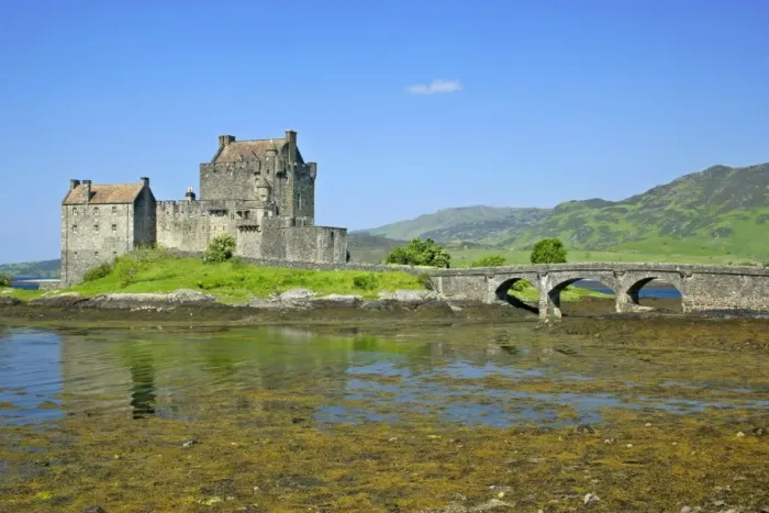 Framed Print : Eilean Donan Castle view of castle located in Loch Duich at low tide on a sunny day Kyle of Lochalsh, Highlands, Scotland, UK Framed Print : Eilean Donan Castle view of castle located in Loch Duich at low tide on a sunny day Kyle of Lochalsh, Highlands, Scotland, UK
