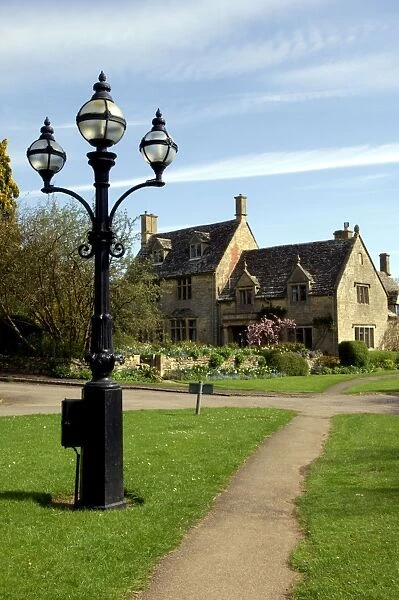 England - A Cotswold village thoroughfare on a Spring morning. April. Cotswolds, UK