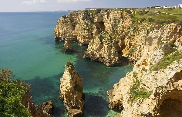 Eroding cliffs, stacks and islets at Ponta da Piedade, near Lagos, Algarve, Portugal