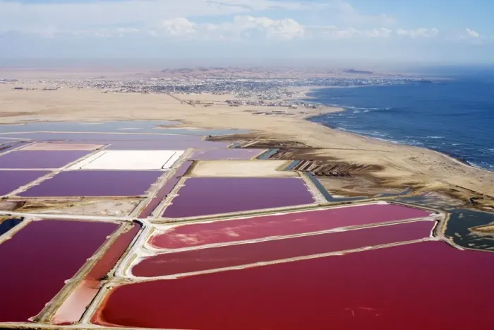 Framed Print : Evaporation ponds for the commercial extraction of sea salt - showing the bright resulting colours - Near Swakopmund - Namib Deser - Atlantic Coast - Namibia - Africa Framed Print : Evaporation ponds for the commercial extraction of sea salt - showing the bright resulting colours - Near Swakopmund - Namib Deser - Atlantic Coast - Namibia - Africa