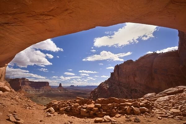 False Kiva - ancient indian ruin tucked into an alcove of rock with a panoramic view over canyons and sandtone buttes - Island in the Sky - Canyonlands National Park - Utah - USA