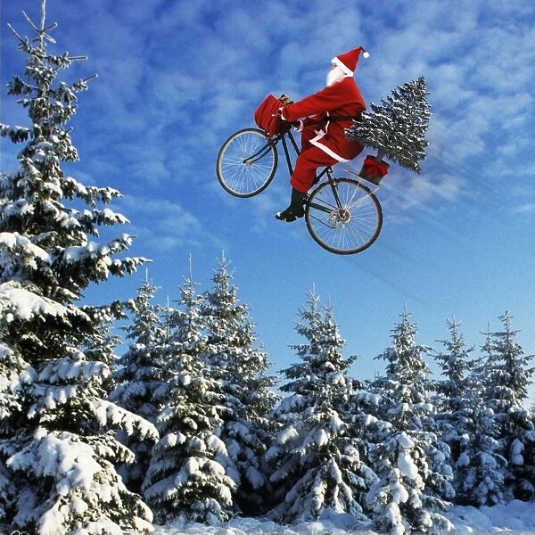 Father Christmas - on bicycle flying through the air Digital Manipulation: Father Christmas (Su). Tree (ME)