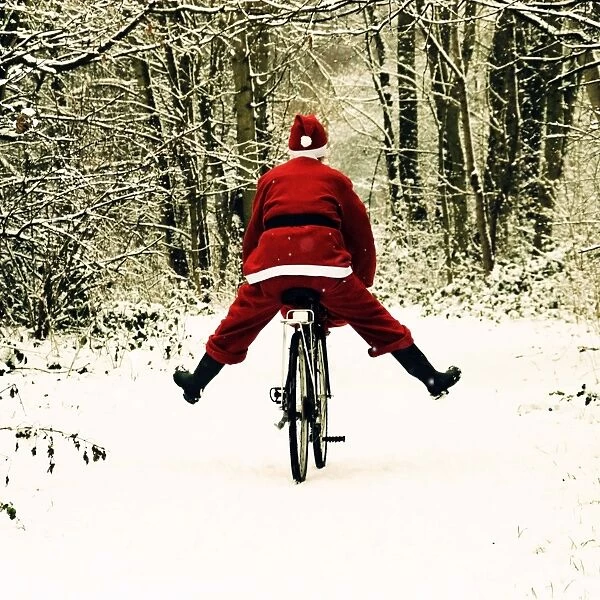 Father Christmas - on a bicycle - freewheeling Digital Manipulation: enhanced colours