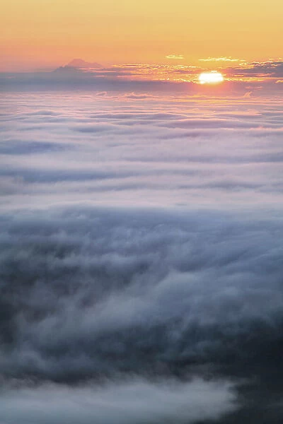 Fog over Puget Sound At sunrise seen from Olympic Mountains. Mount Baker is in the distance Date: 15-07-2021