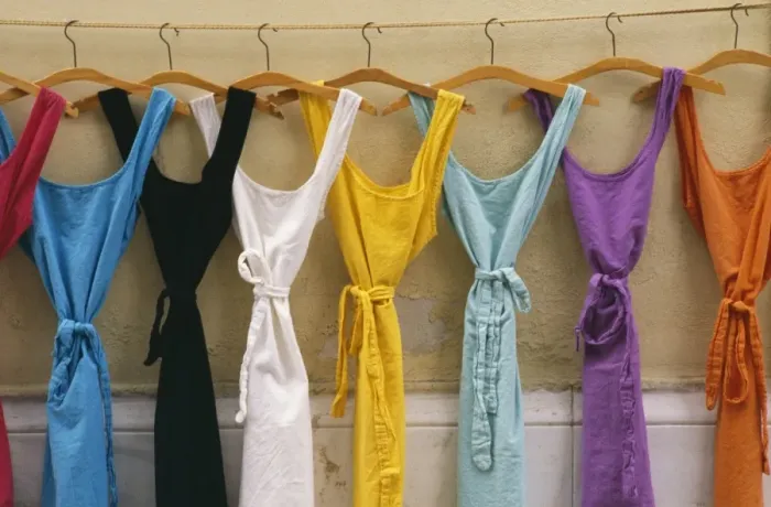 Framed Print : France Provence. Multi coloured dresses hanging in a row Framed Print : France Provence. Multi coloured dresses hanging in a row
