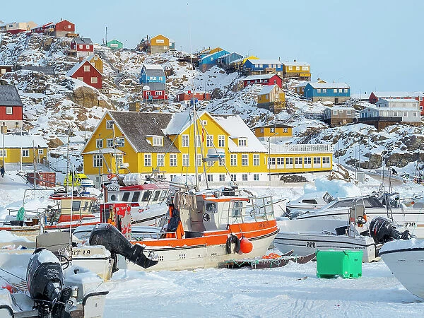 The frozen harbor of Uummannaq during winter in northern West Greenland beyond the Arctic Circle. Greenland, Danish territory Date: 08-03-2020