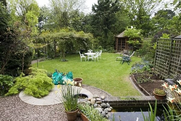 Garden - attractive suburban back garden with pond. Cheltenham - UK