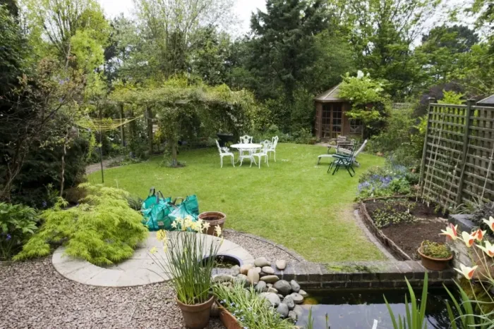 Framed Print : Garden - attractive suburban back garden with pond. Cheltenham - UK Framed Print : Garden - attractive suburban back garden with pond. Cheltenham - UK
