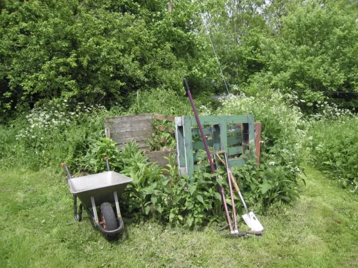 Framed Print : Garden compost area with wheelbarrow and tools Framed Print : Garden compost area with wheelbarrow and tools