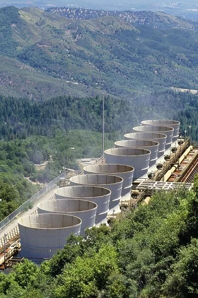 Geothermal Energy - steam leaves cooling towers at steam driven electrical power plant Sonoma, California, USA