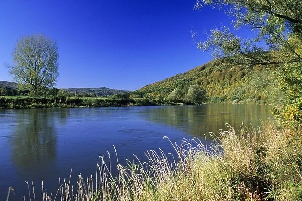 Germany - River Weser and surrounding forestry covered hills, early autumn Lower Saxony, Germany