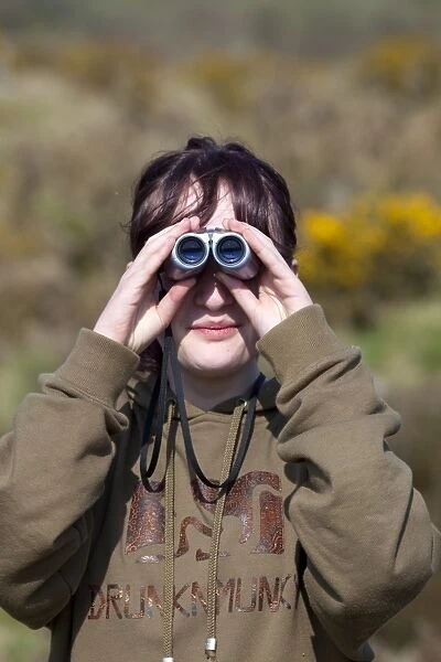 Girl Birdwatching using binoculars