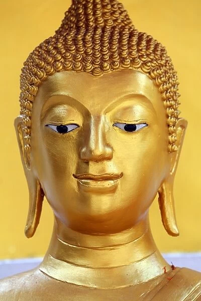 Gold Buddha statue head and face at Wat Panping Temple i