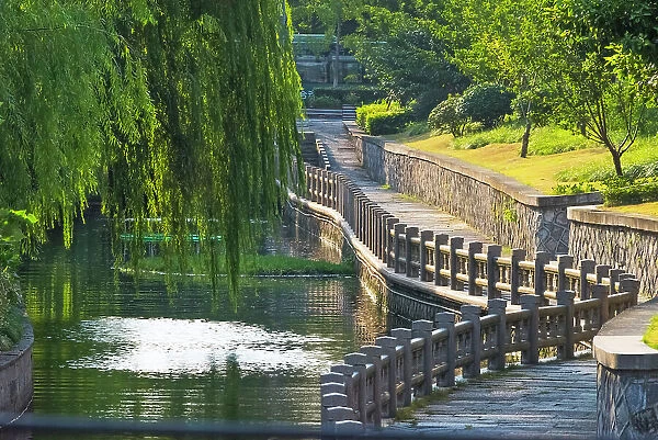 Gongchen Bridge with willow tree, eastern end of the Grand Canal, Hangzhou, Zhejiang Province, China Date: 24-09-2018