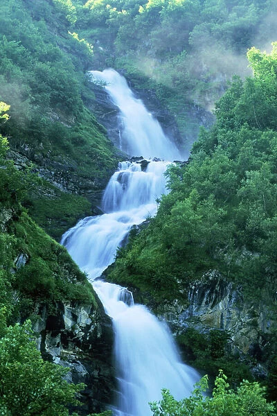 Gross Glockner National Park - mountain stream & cascading waterfall - in Gross Glockner National Park, Austrian Alps, Austria