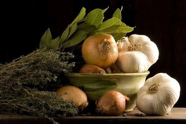 Herbs & Vegetables in bowl - bay leaves, garlic, onions, sage