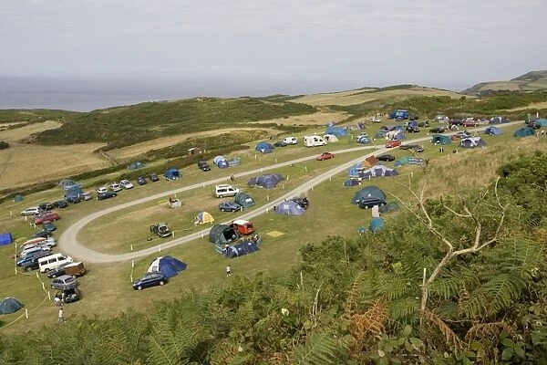 Holiday tents and caravans on sloping fields on cliffs