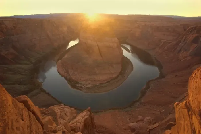 Framed Print : Horseshoe Bend - dramatic view of a nearly 360 degree bend of the Colorado river cut into the colorado plateau. At sunset, with the setting sun about to vanish behind the horizon - Horseshoe Bend, Arizona, USA Framed Print : Horseshoe Bend - dramatic view of a nearly 360 degree bend of the Colorado river cut into the colorado plateau. At sunset, with the setting sun about to vanish behind the horizon - Horseshoe Bend, Arizona, USA