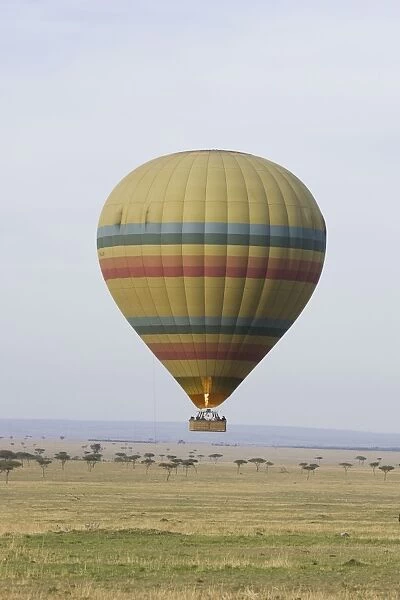 Hot Air Balloon flying over plains during early morning - Masai Mara - Kenya