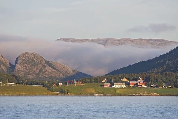 Houses by waters edge - with hills & low cloud behind - Lauvsnes - Flatanger - Norway