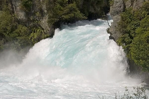 Huka Falls on Waikato river near Taupo North Island New Zealand. Of great important for electricity generation it supplies 8 hydroelectric schemes and water for cooling for 2 geothermal units. The average daily flow is 160 cub metres per second