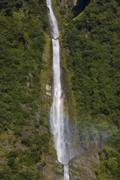 Framed Print : Humboldt Falls waters of Humboldt Falls drop 275 m down a steep cliff Hollyford Valley, Fjordland National Park, South Island, New Zealand