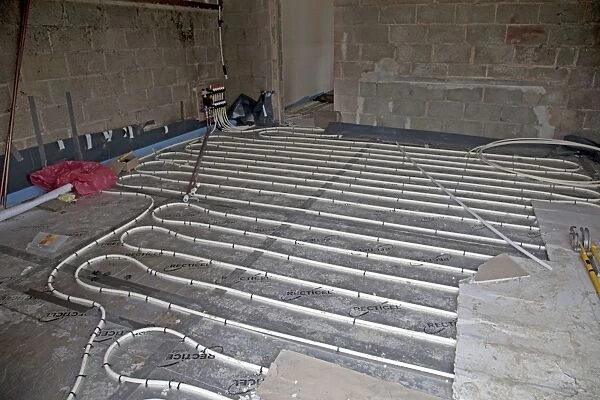 Installing underfloor heating pipes in new office building - Cheltenham - UK