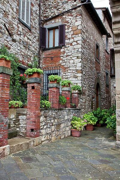 Italy, Radda in Chianti. Entrance to homes along the streets of Radda in Chianti. Date: 26-09-2010