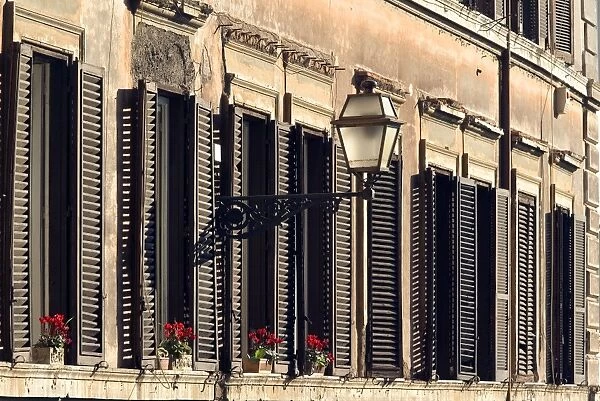Italy - Rome - street scene with window shutters and window boxes