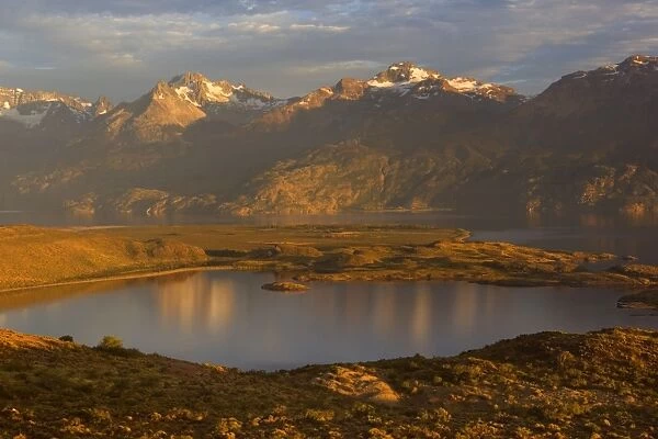 Lago General Carrera and mountains - view from south eastern shoreline in early morning light - mountain peaks reflect in lake's calm surface - Northern Patagonia - Chile - South America