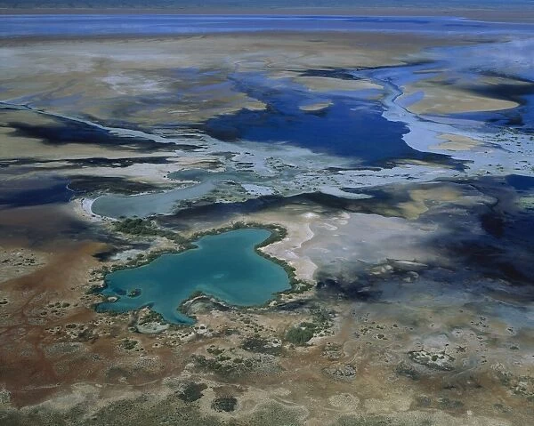 Lake MacLeod salt lake mineral-laden artesian water surfacing on lake's edge. Aerial. Western Australia JPF44357