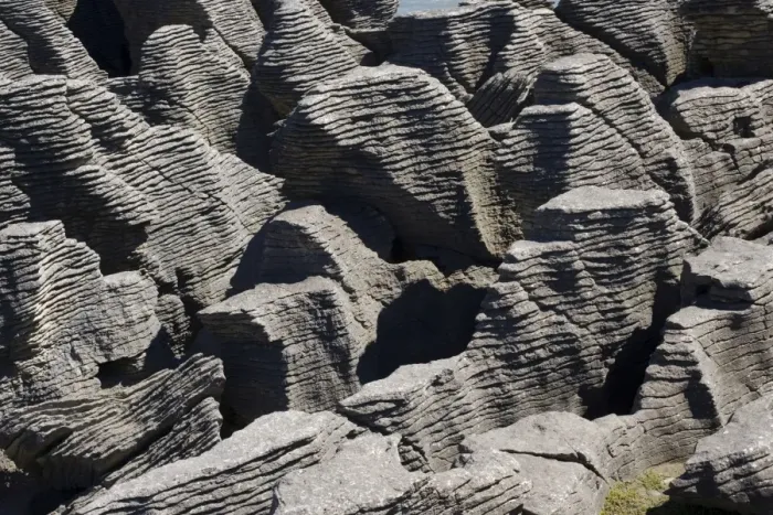 Framed Print : Limestone outcrops on cliffs. Punakaiki - South Island - New Zealand. Pancake rocks form the main focus for visitors in Paparoa National Park where huge outcrops of limestone have been formed by a process called stylobedding Framed Print : Limestone outcrops on cliffs. Punakaiki - South Island - New Zealand. Pancake rocks form the main focus for visitors in Paparoa National Park where huge outcrops of limestone have been formed by a process called stylobedding