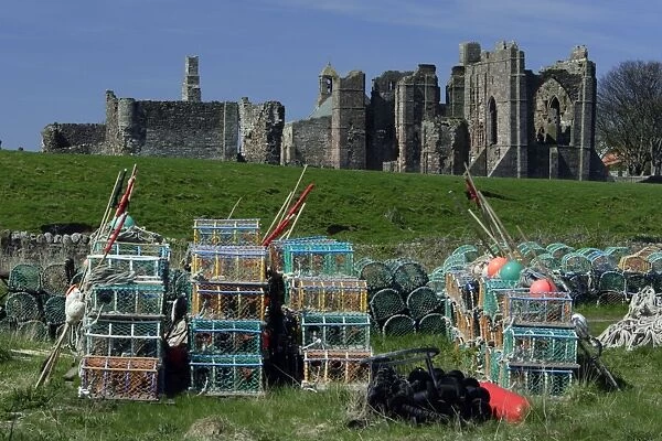 Lindisfarne, Holy Island-Lobster pots in front of monasty ruins, Northumberland UK