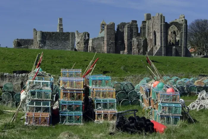 Framed Print : Lindisfarne, Holy Island-Lobster pots in front of monasty ruins, Northumberland UK Framed Print : Lindisfarne, Holy Island-Lobster pots in front of monasty ruins, Northumberland UK