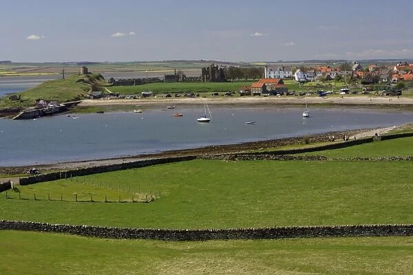 Lindisfarne, Holy Island-view of harbour, village and monastry, Northumberland UK