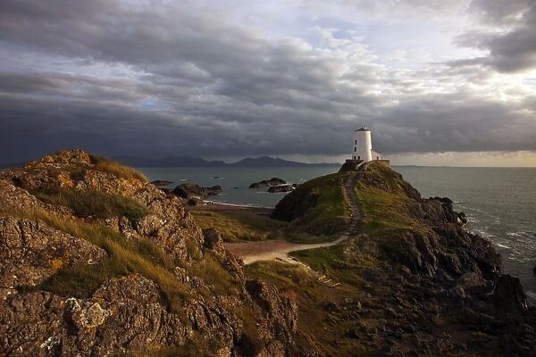 Llanddwyn lighthouse on Anglesey in late evening light - September - North Wales
