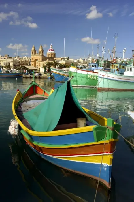 Framed Print : Malta - Marsaxlokk Bay is charming, and the most important fishing port on. The multi-coloured fishing boats are traditional Maltese and are called Luzzu The Bay is vulnerable Framed Print : Malta - Marsaxlokk Bay is charming, and the most important fishing port on. The multi-coloured fishing boats are traditional Maltese and are called Luzzu The Bay is vulnerable