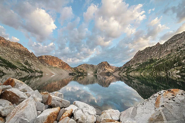 Morning clouds mirrored in still waters of Sawtooth Lake, Sawtooth Mountains Wilderness, Idaho. Date: 01-08-2019