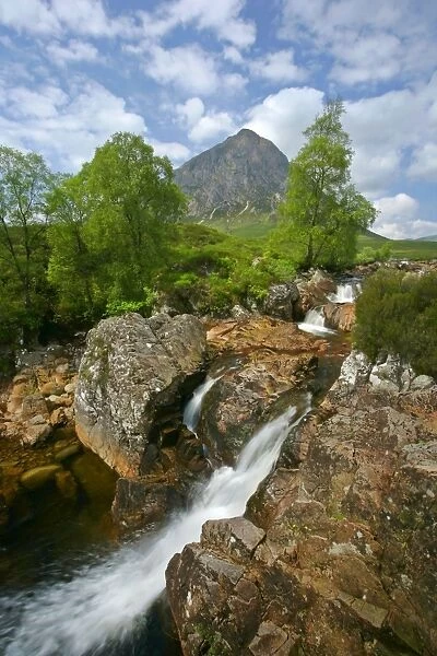 Mountain scenery Buachaille Etive Mor and waterfalls of Coupal river at low water level with red rocks and boulders visible Glen Etive, Glencoe area, Highlands, Scotland, UK